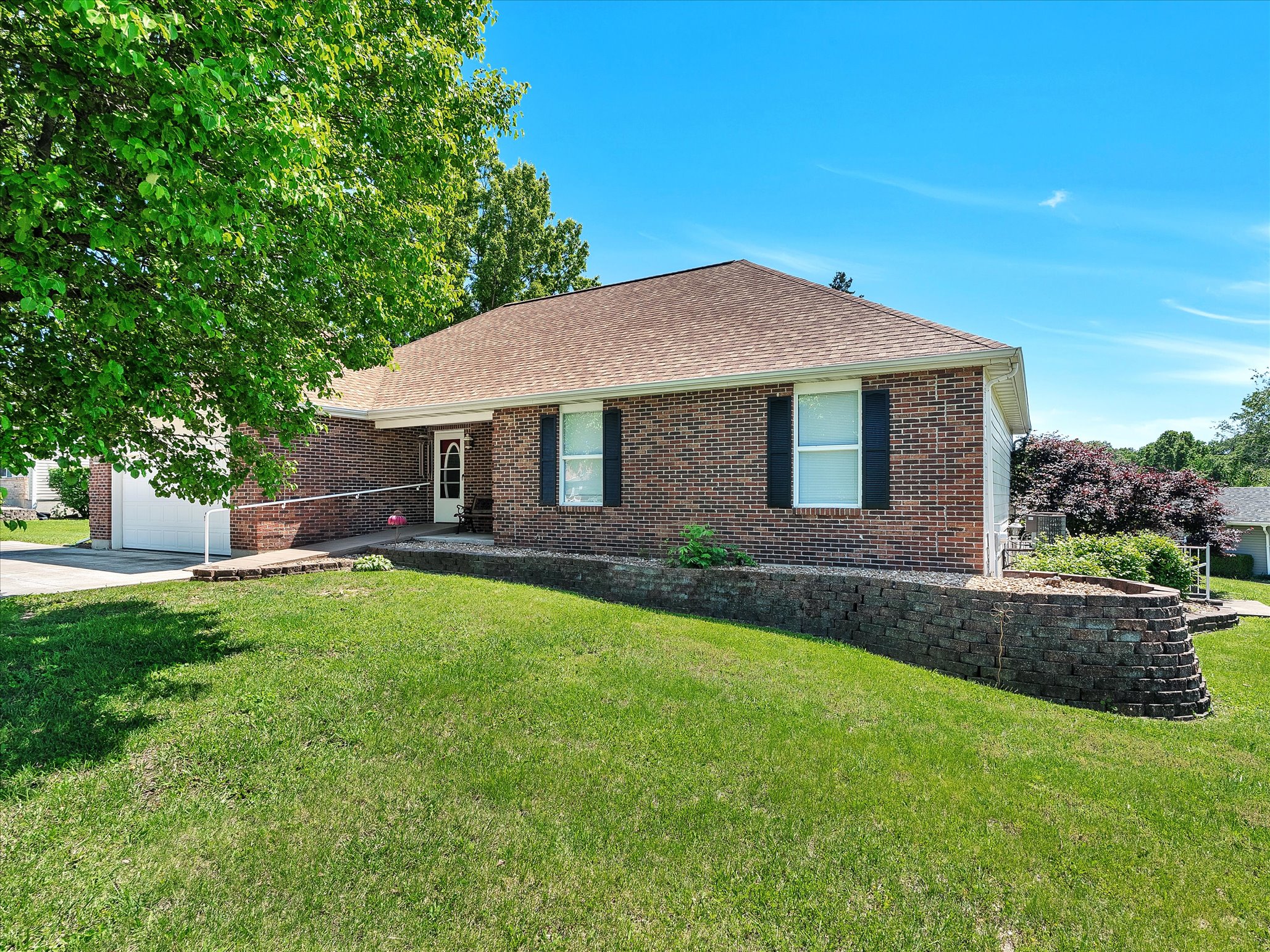 Front exterior of 2215 Pine Lake Loop, Gray Summit MO &mdash; brick ranch home
