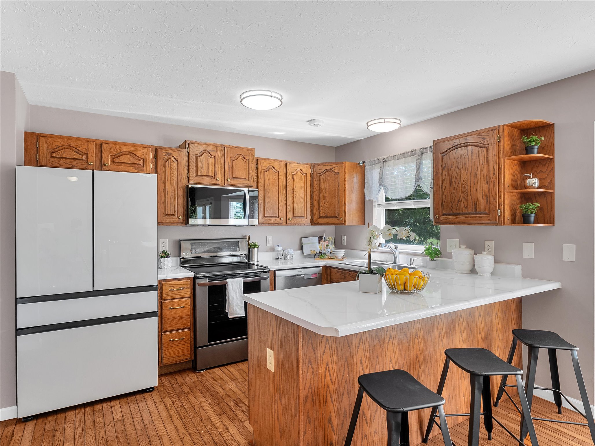 Updated kitchen with white quartz countertops