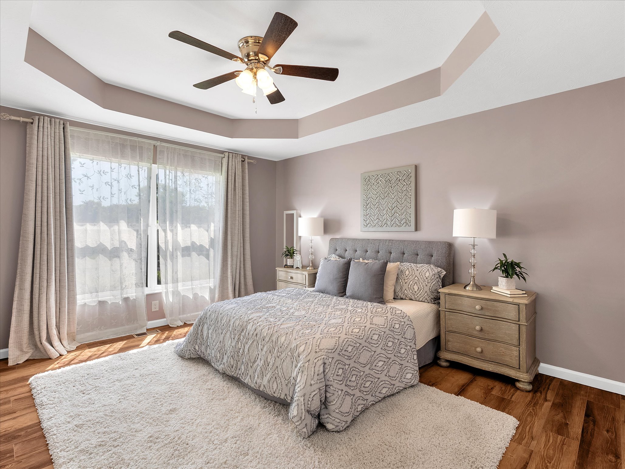 Primary bedroom with tray ceiling