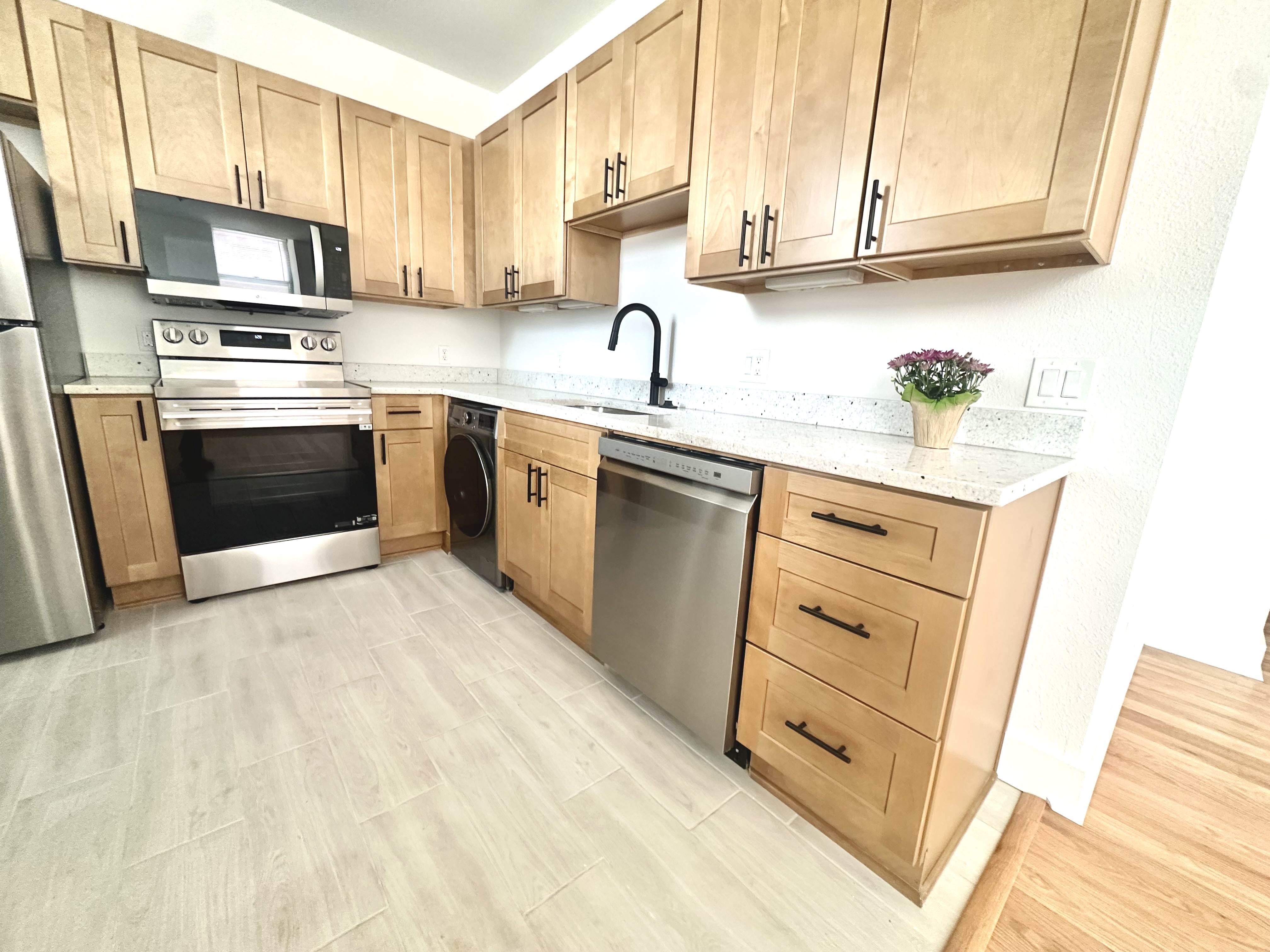 Kitchen with matte-black faucet and undermount stainless sink