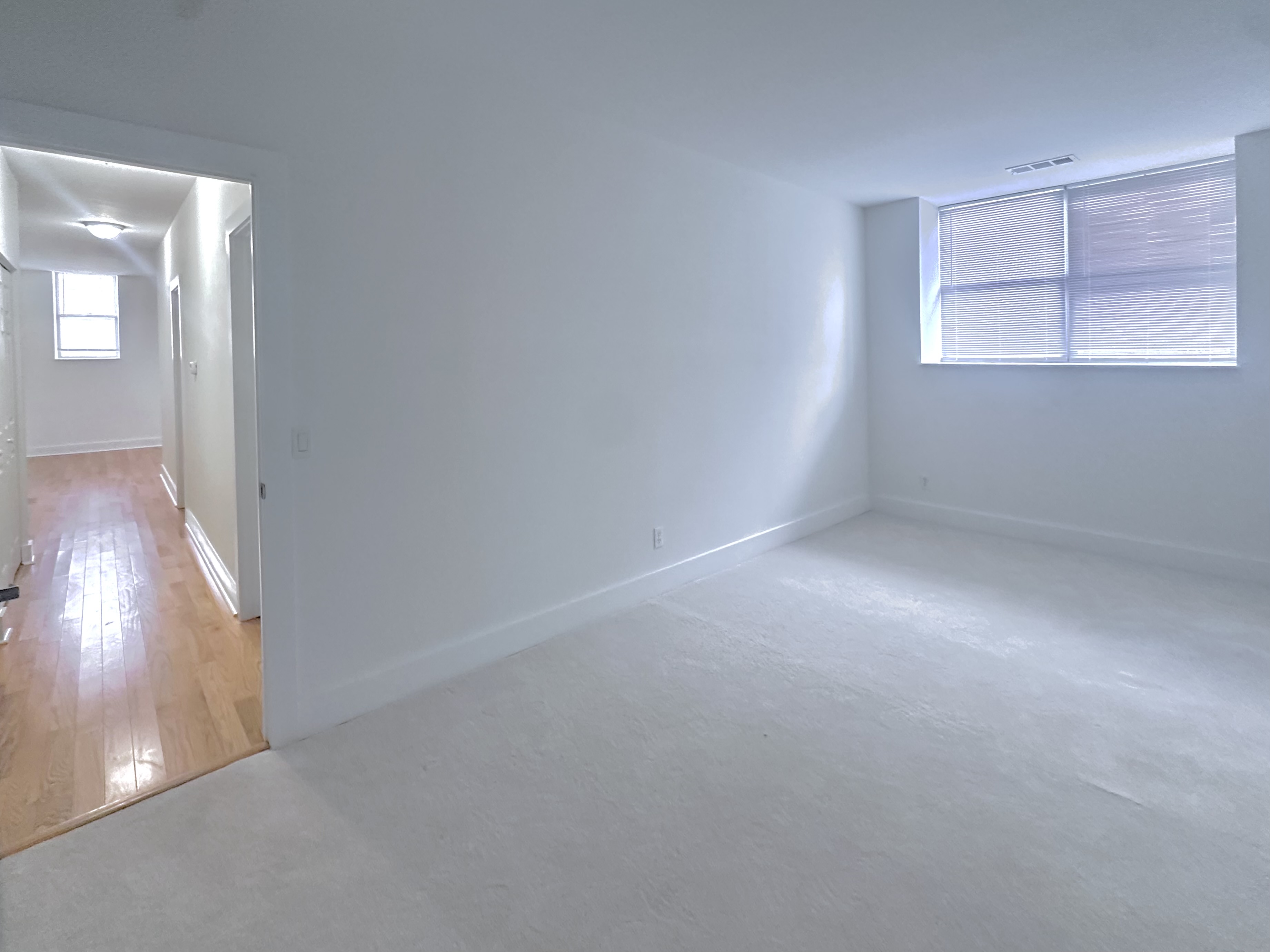 Living room with view of the hallway leading to the bedrooms